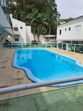 Casa nova com 3 quartos, equipada com Ar Condicionado, TV, Internet e Área de Lazer Completa - Boiçucanga